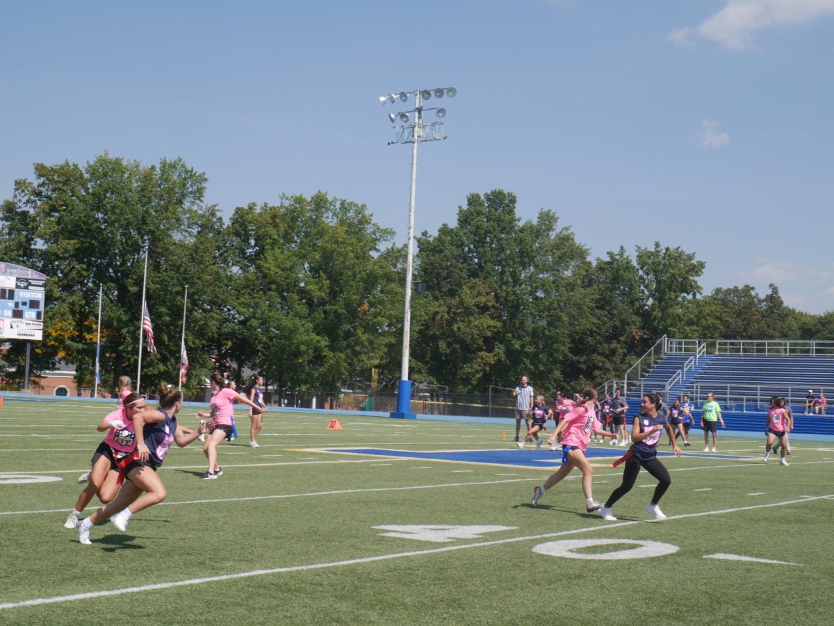 Juniors and seniors run to catch the ball.