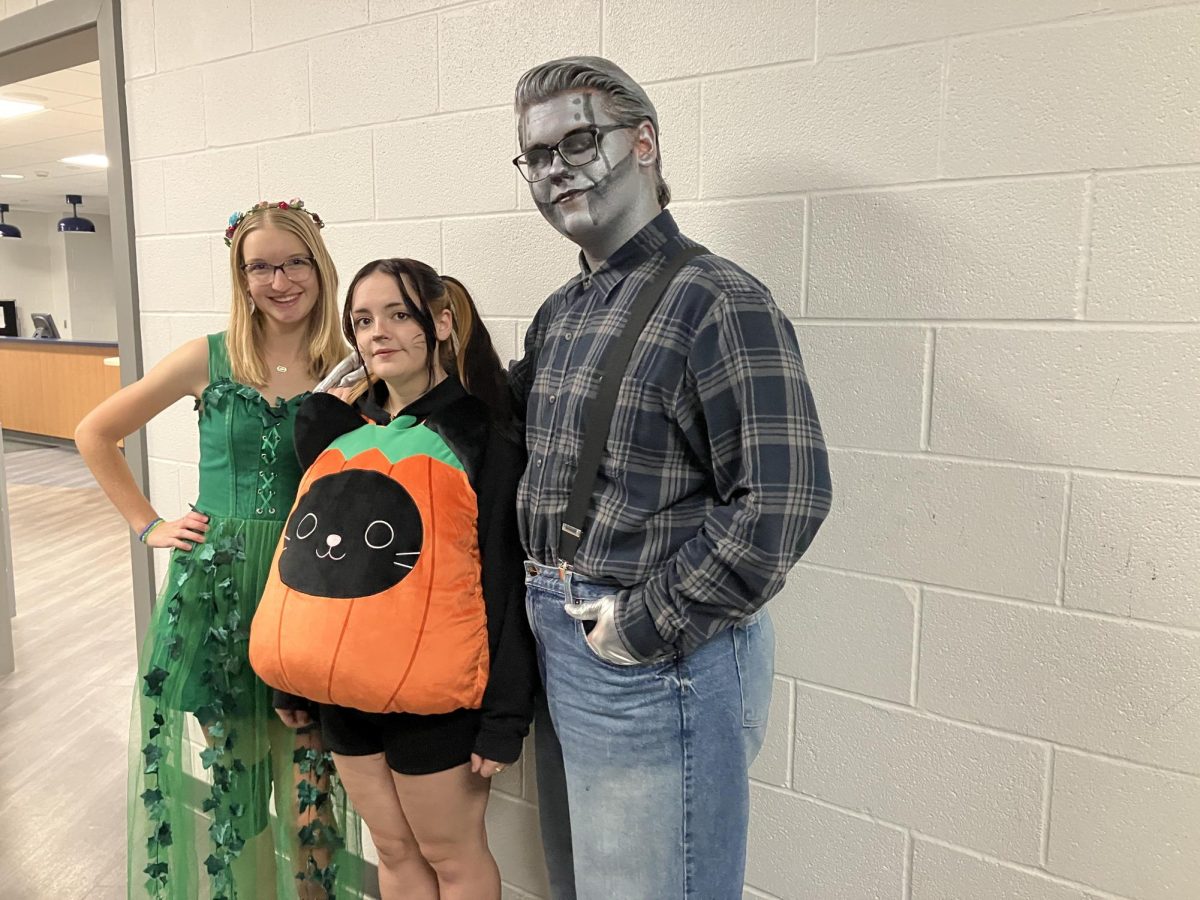 L to R: Rylee Shepard (Poison Ivy), Maddie Kerns (Pumpkin Cat) and Robby Kalman (Tin Man)