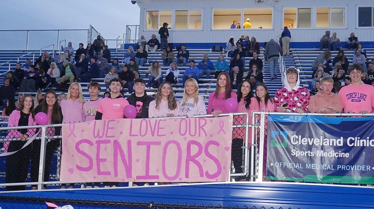 Seniors showing their spirit and supporting the football team on Senior Night