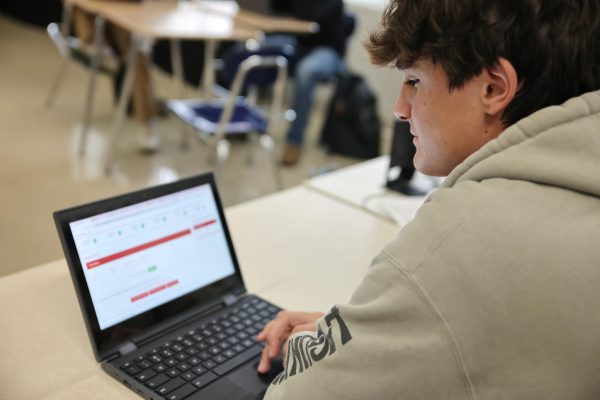 Senior Anthony Sobonya checks his stocks while competing in the Ohio Stock Market Challenge.