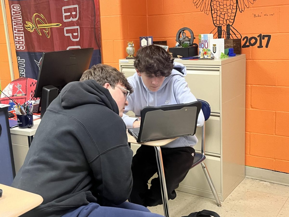 Freshmen Jacob Jana and Mason Washington working together to get the lowest score possible on the simulator.