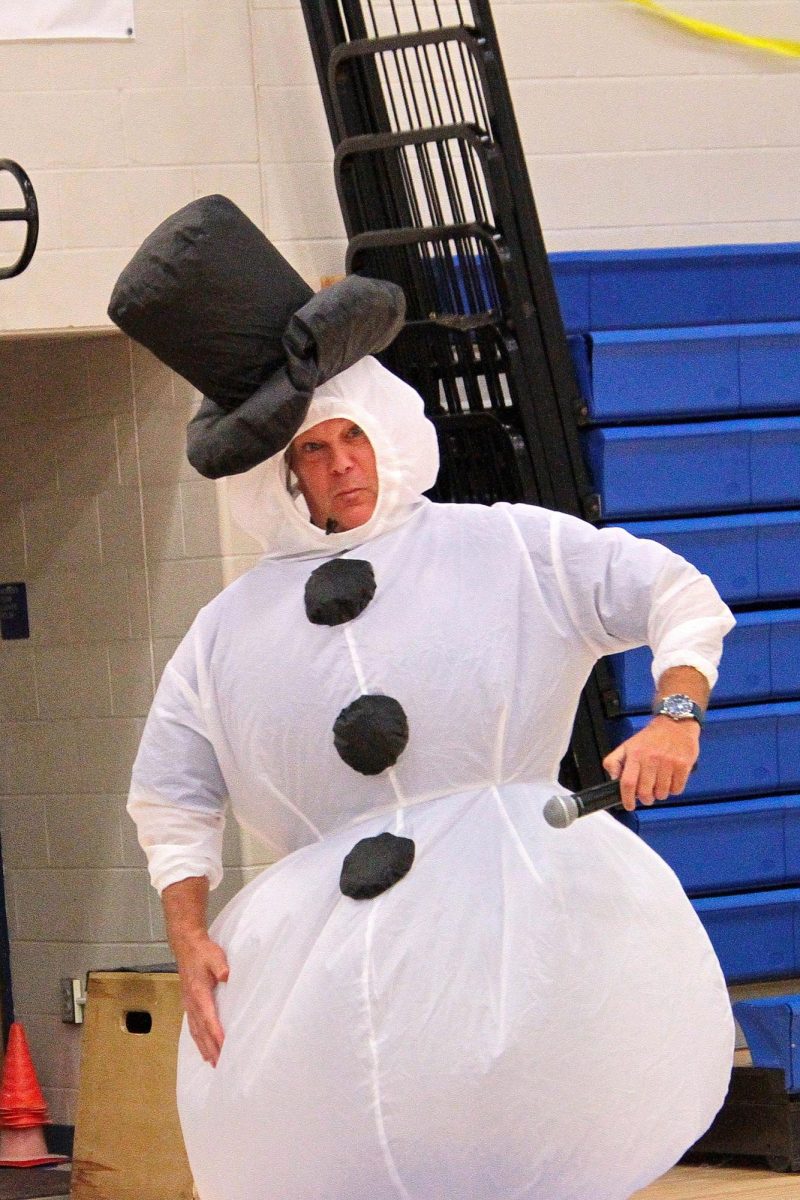 Principal Janatovich preparing to speak at the Halloween assembly