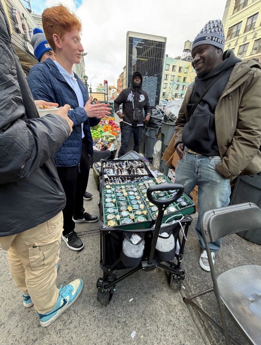 Senior Grady Wachs bargains with an NYC street vendor for watches.