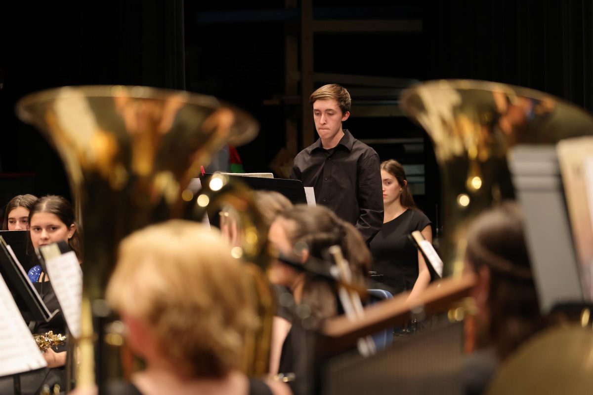 Freshman Sam Perlman playing his bell solo during the song "Son of Santa the Barbarian"