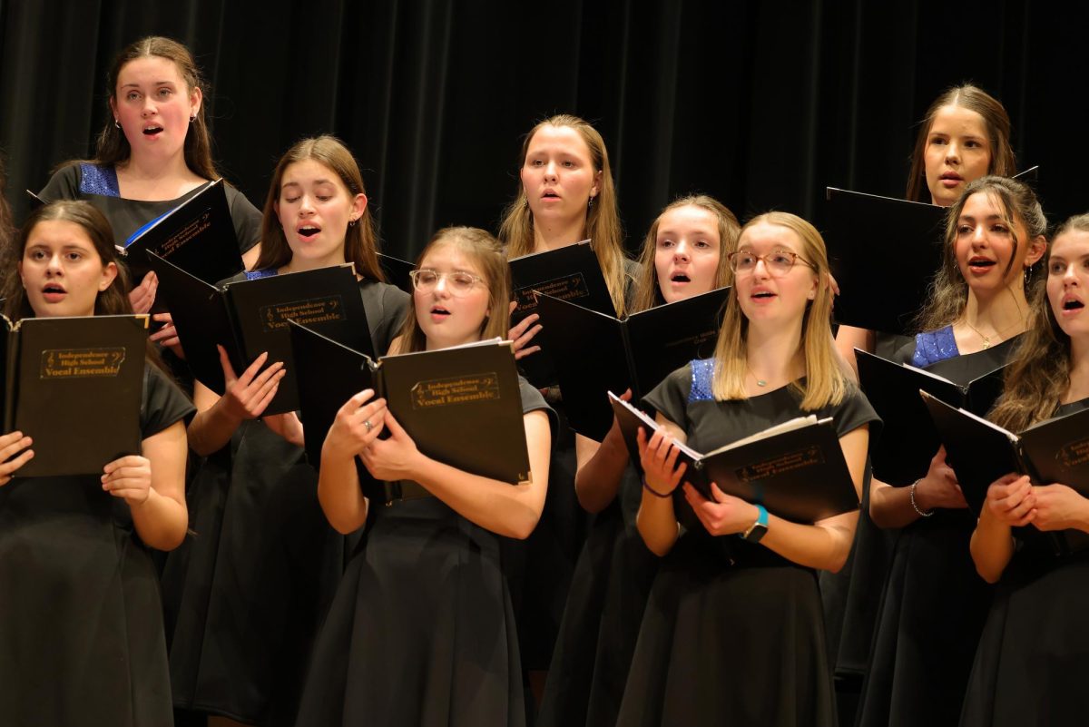 A group of choir members singing for the IHS Vocal Ensemble.