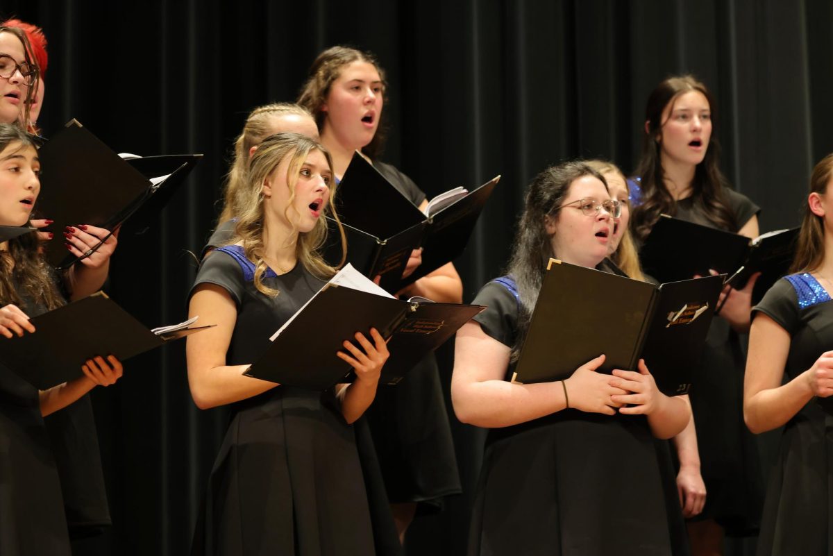 A group of girls singing for the IHS Vocal Ensemble.