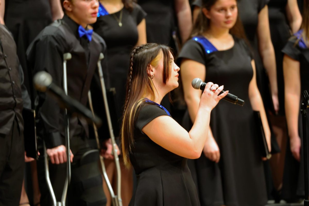 Senior Maddie Kern singing her solo during "Blue Christmas"