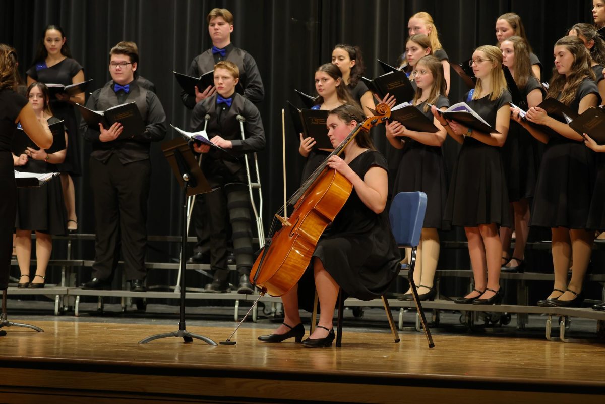 Senior Tillie Averre playing the cello during "O Come, Emanuel" 