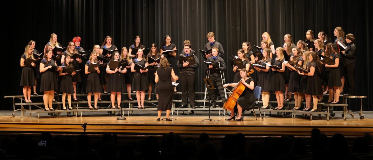 IHS Vocal Ensemble preforming O Come, Emmanuel with senior Tillie Averre on cello.