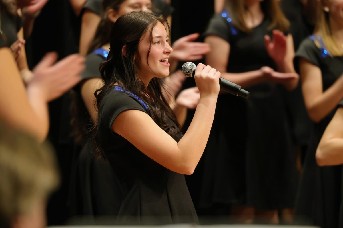 Senior Brooke Vollman singing her solo during