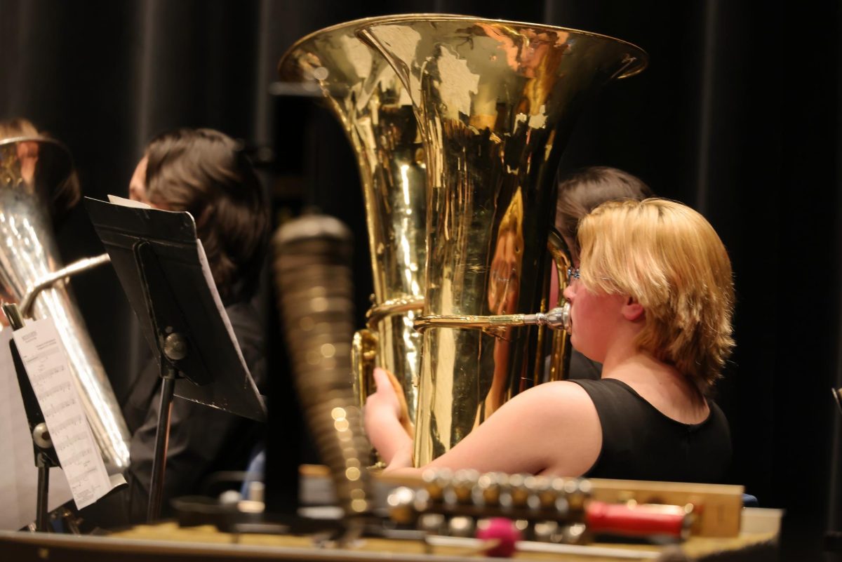 Freshman Quincy Carlisle playing during the IHS Wind Ensemble concert.