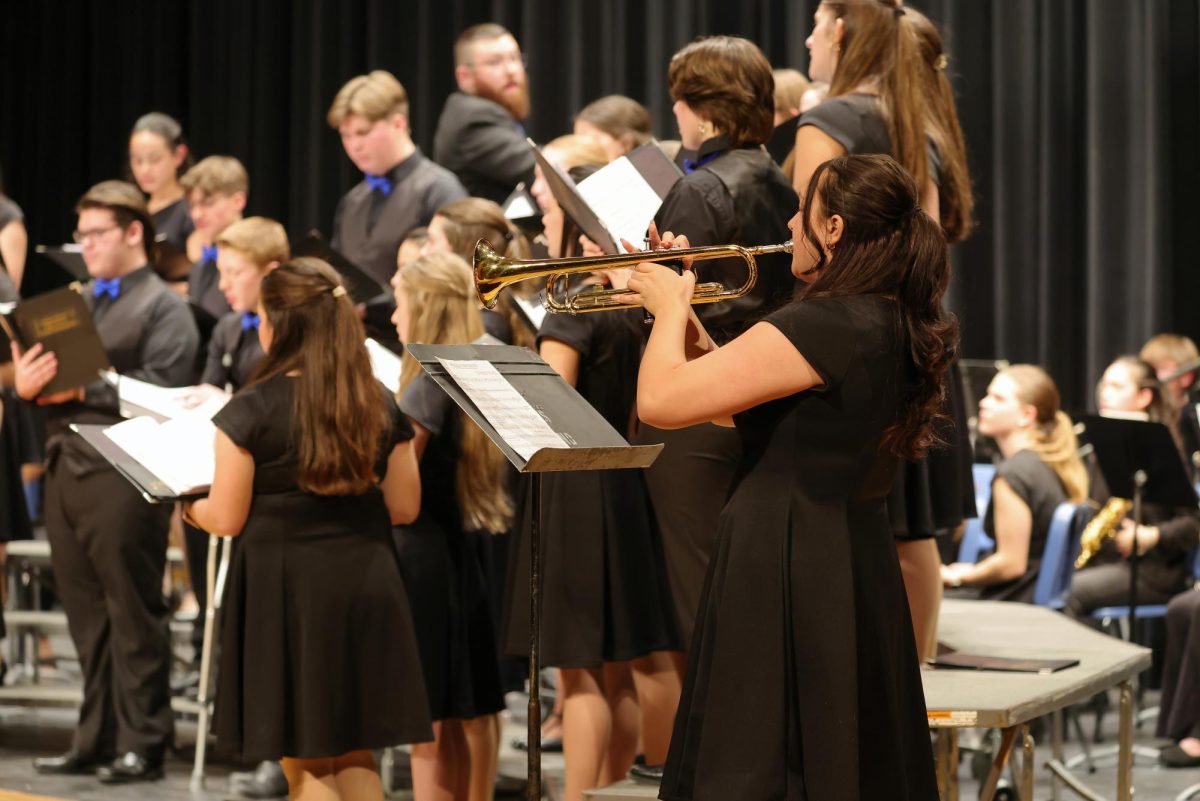 Senior Gianna Londrico playing her solo during the joint band and choir song "Holiday Favorites"