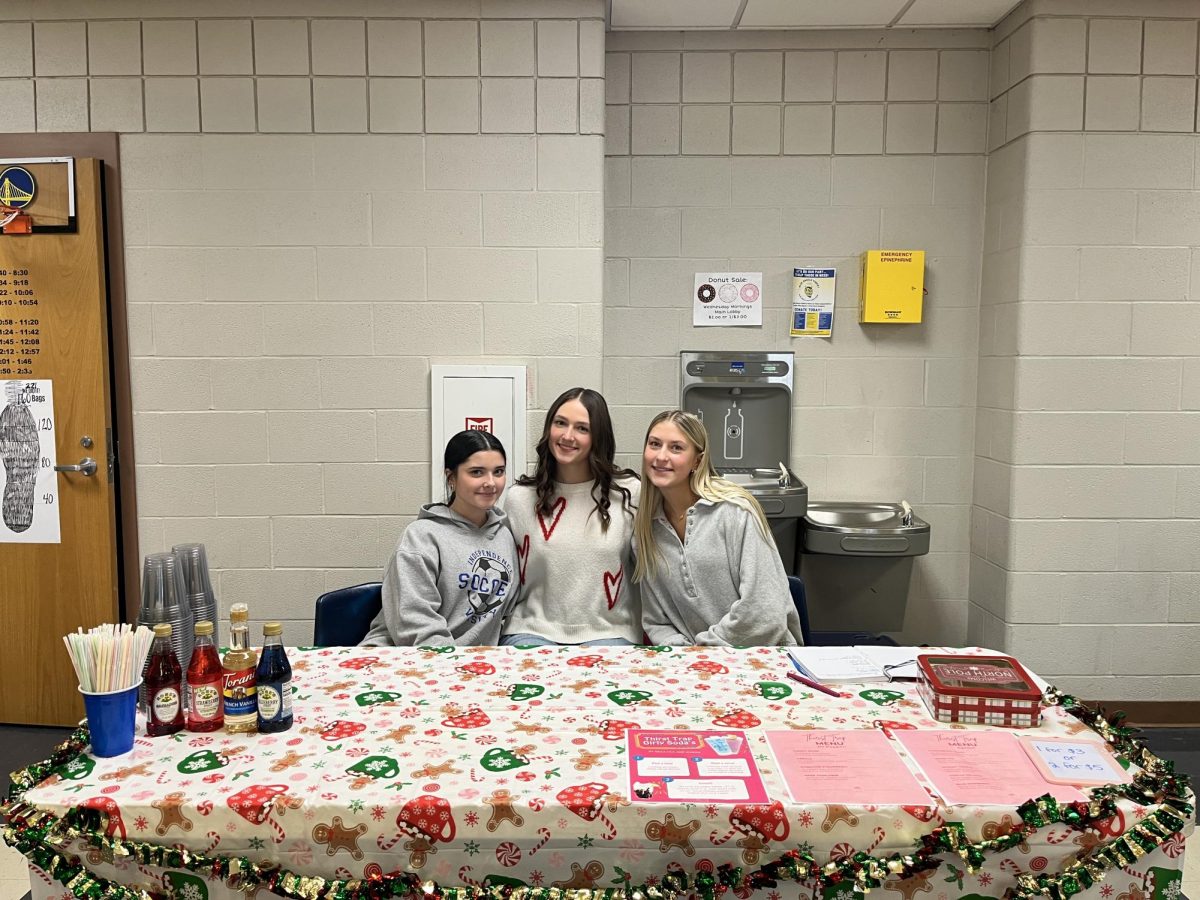 Sophomores Bella Patacca, Lila Manfredonia, and Marisa Mudra waiting to sell dirty sodas before lunch.