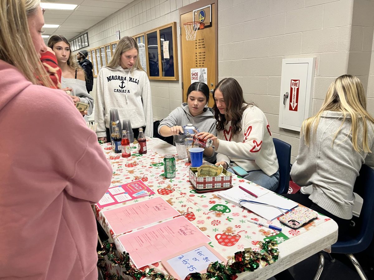 Sophomores Bella Patacca, Lila Manfredonia, and Marisa Mudra selling their dirty sodas during 5A lunch.