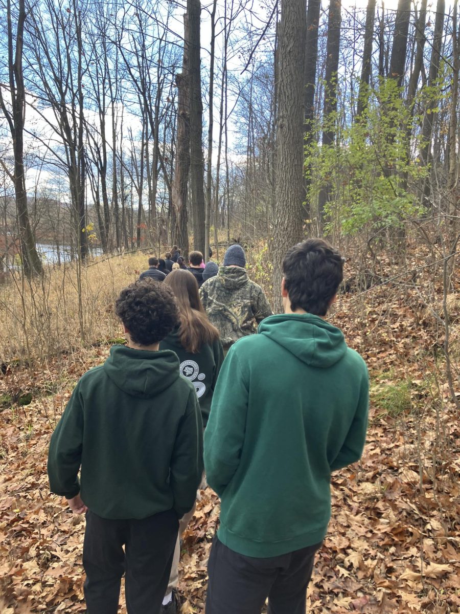 Students hike beside the Cuyahoga River.