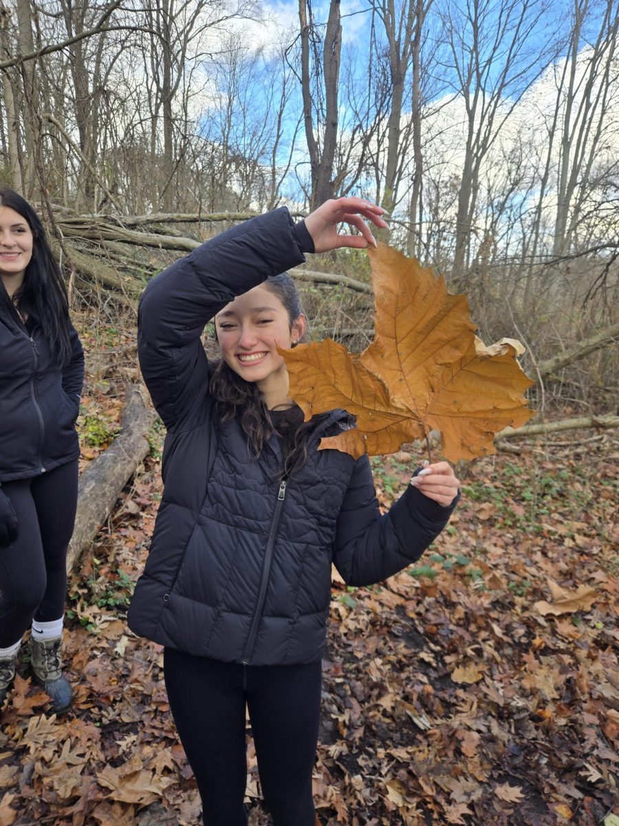 Junior Noelle Kitagawa poses with her large sycamore leaf.