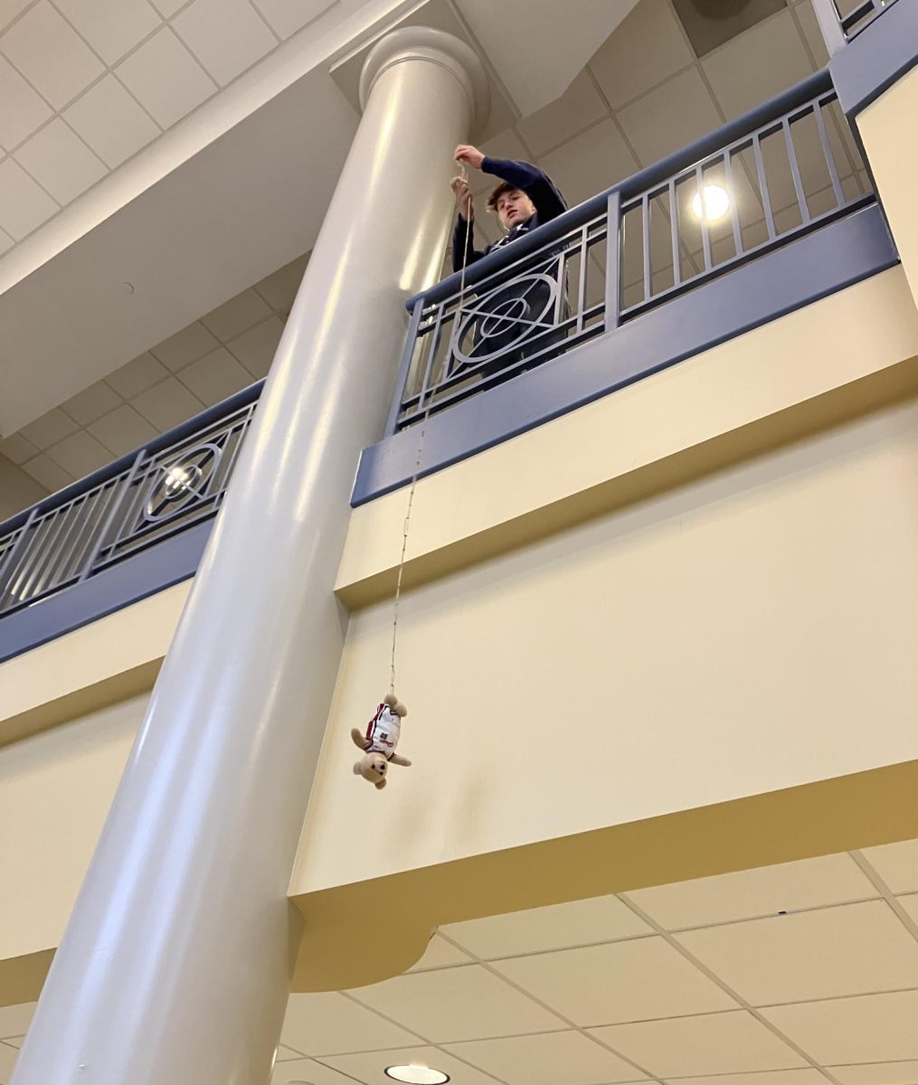 Ryan Mack retrieves his contestant after dropping it.