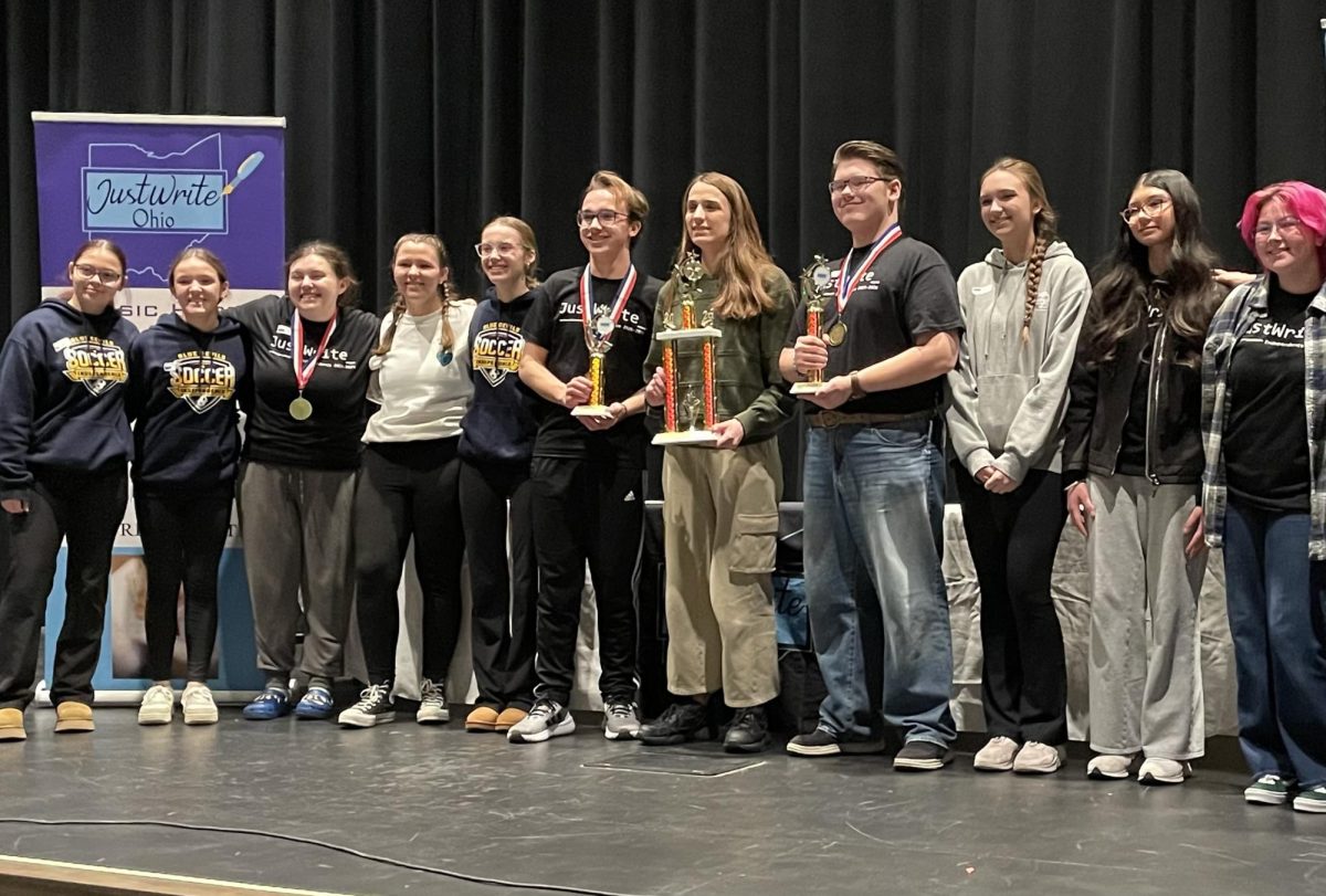 IHS JustWrite team poses with their awards.
L to R: Caitlynn Barry, Nicole Mehosky, Mes Sheehan, Veronica Kasperski, Penny McGurr, Matthew Liepert, Tatiana Randjelovic, Robby Kalman, Adriana Randjelovic, Sehajveer Rai, Quincy Carlisle
Not pictured: Samantha Kandzer