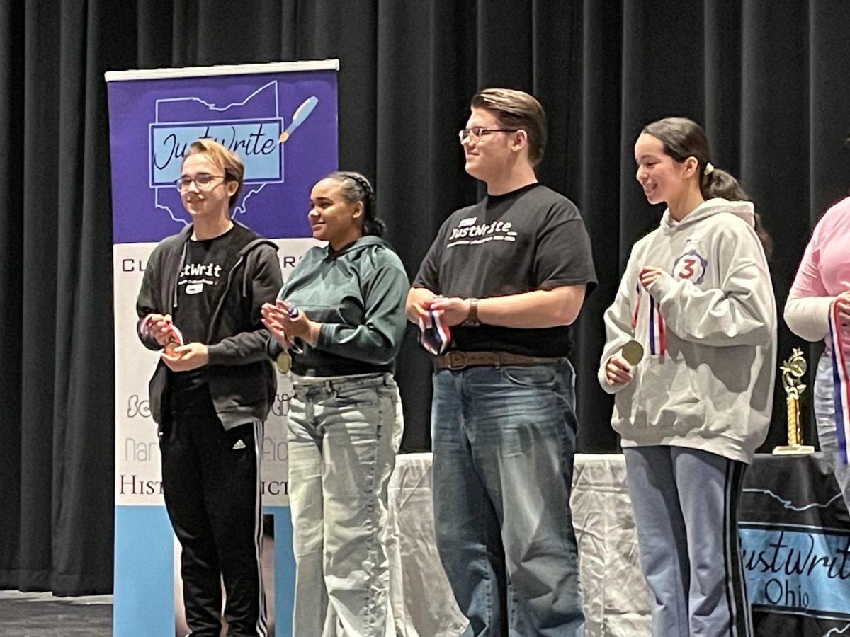Matthew Liepert (first from left) and Robby Kalman (third from left) hold their medals.