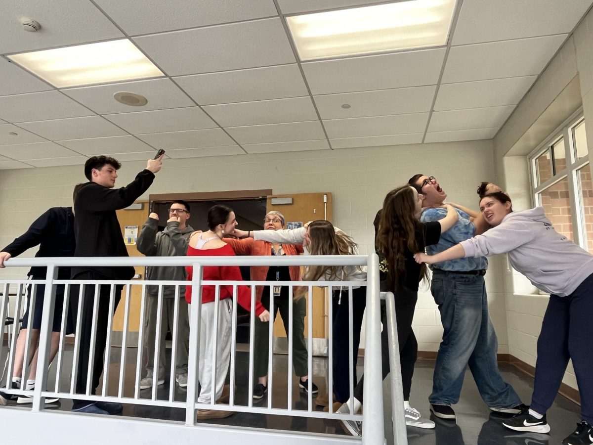 John Fricano, Ryan Suhy, Logan McMullan, Alyssa Carriero, Mrs. Jean Kanzinger, Taylor Prosinski, Lilia Pawuk, Robby Kalman, and Tillie Averre fighting over the colors of the four subjects.