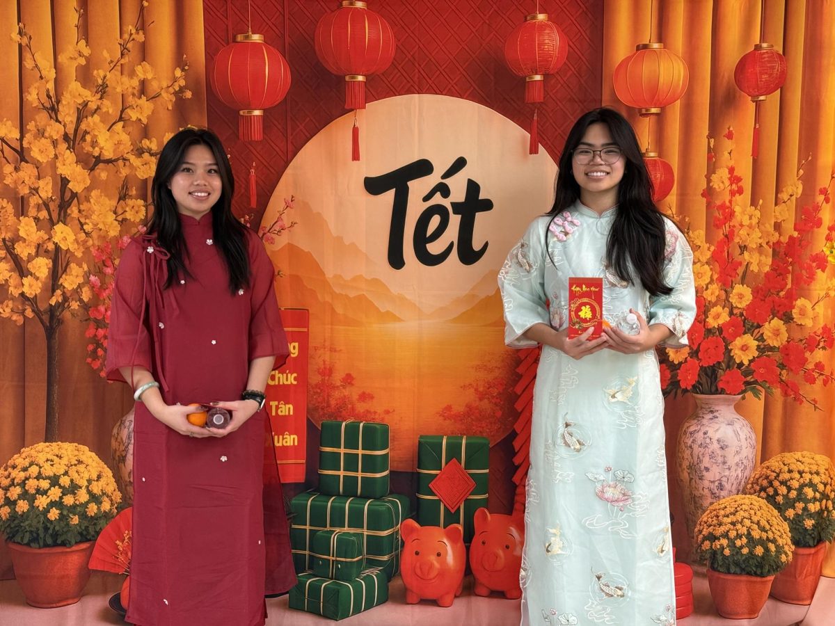 Lexi and Lindsey Lieu adorning their Áo Dài dresses in temple on Lunar New Year
