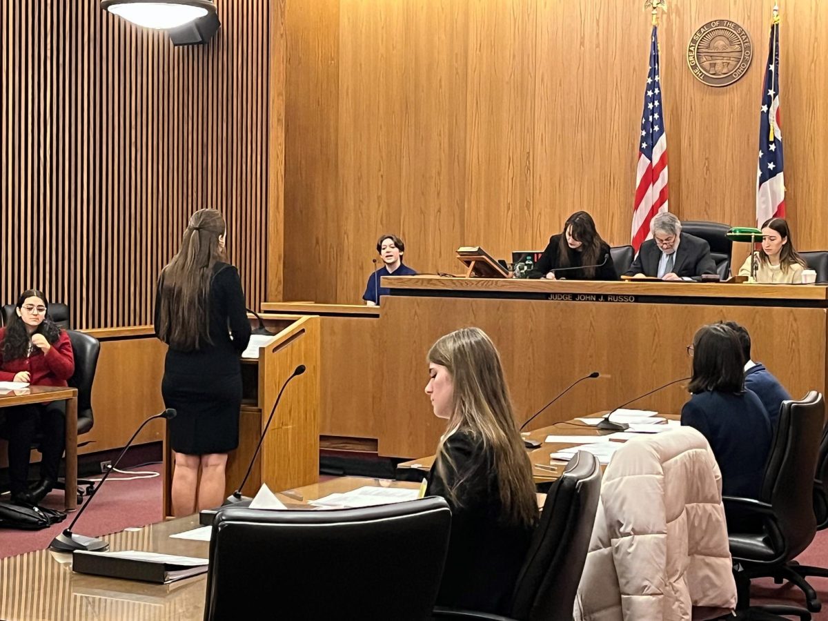 Defense attorney Adriana Randjelovic conducts direct examination of witness Haven Peeters (Vinny Carmean).