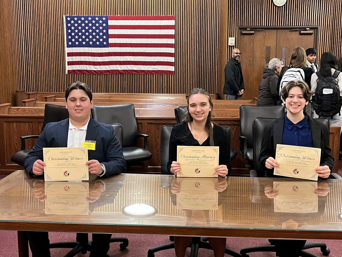 Students hold their awards at the district tournament.
Gio Hasrouni (Outstanding Witness), Adriana Randjelovic (Outstanding Attorney), Vinny Carmean (Outstanding Witness)