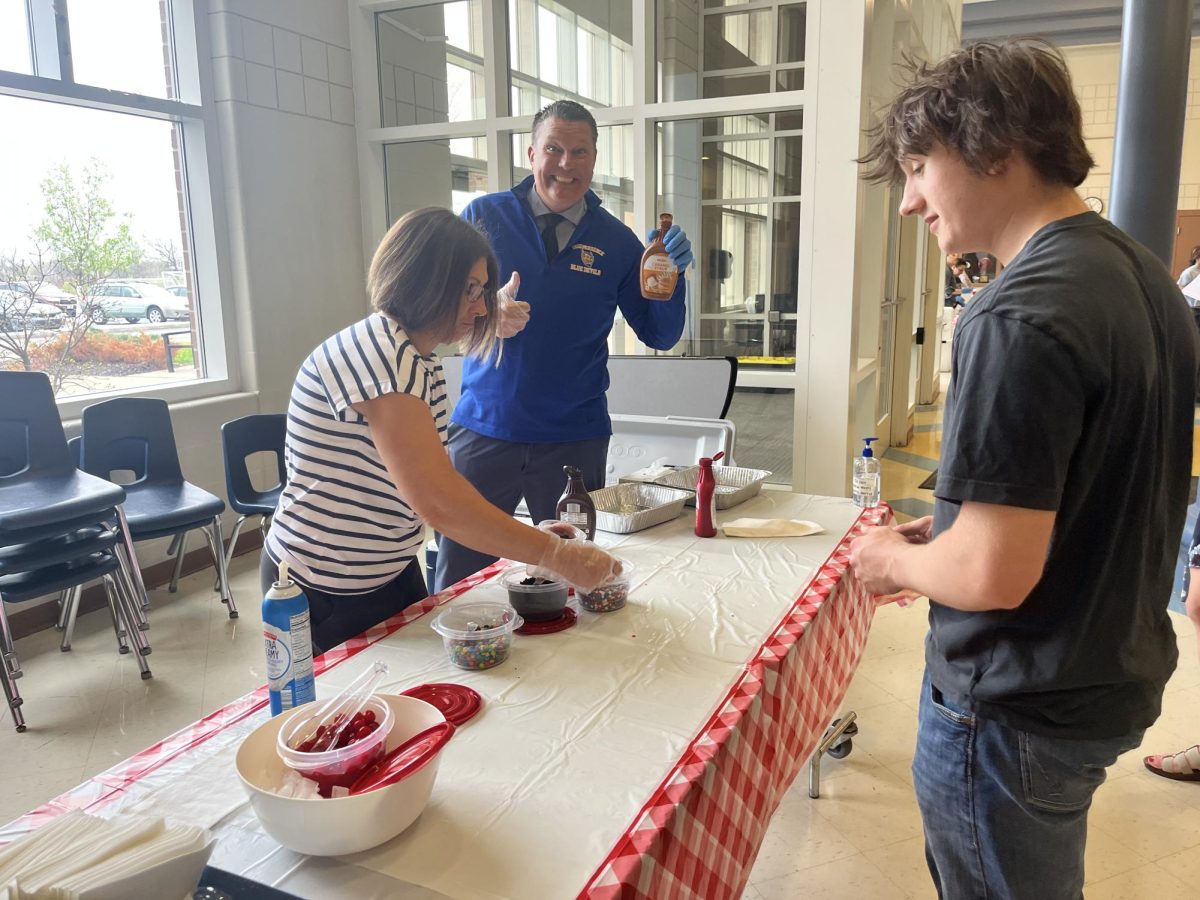Mr. Mike Janatovich and Mrs. Jessica Carmean working the ice cream social