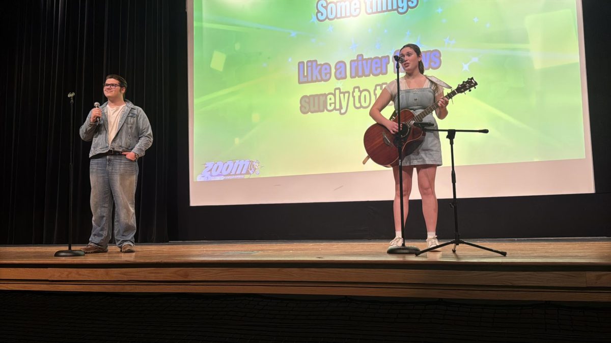 Junior Robby Kalman and senior Tillie Averre preforming their song "Can't Help Falling In Love"  by Elvis Presley