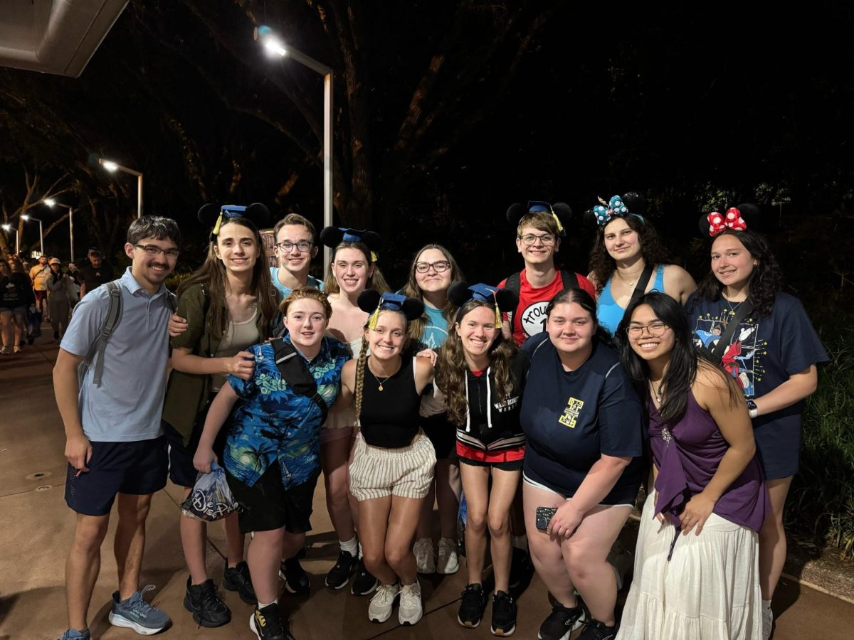 The Indy Music Department seniors posing after their last day in Disney. (Top Row: Nathan Lu, Tatiana Randjelovic, Matthew Liepert, Tillie Averre, Gabrielle LaRiccia, Paul Kundmueller, Nora Olexa, Gianna Londrico. Bottom Row: Tevin Cullison, MaryAnne Leroy, Samantha Kandzer, Gracie Mindzora, Lindsey Lieu).