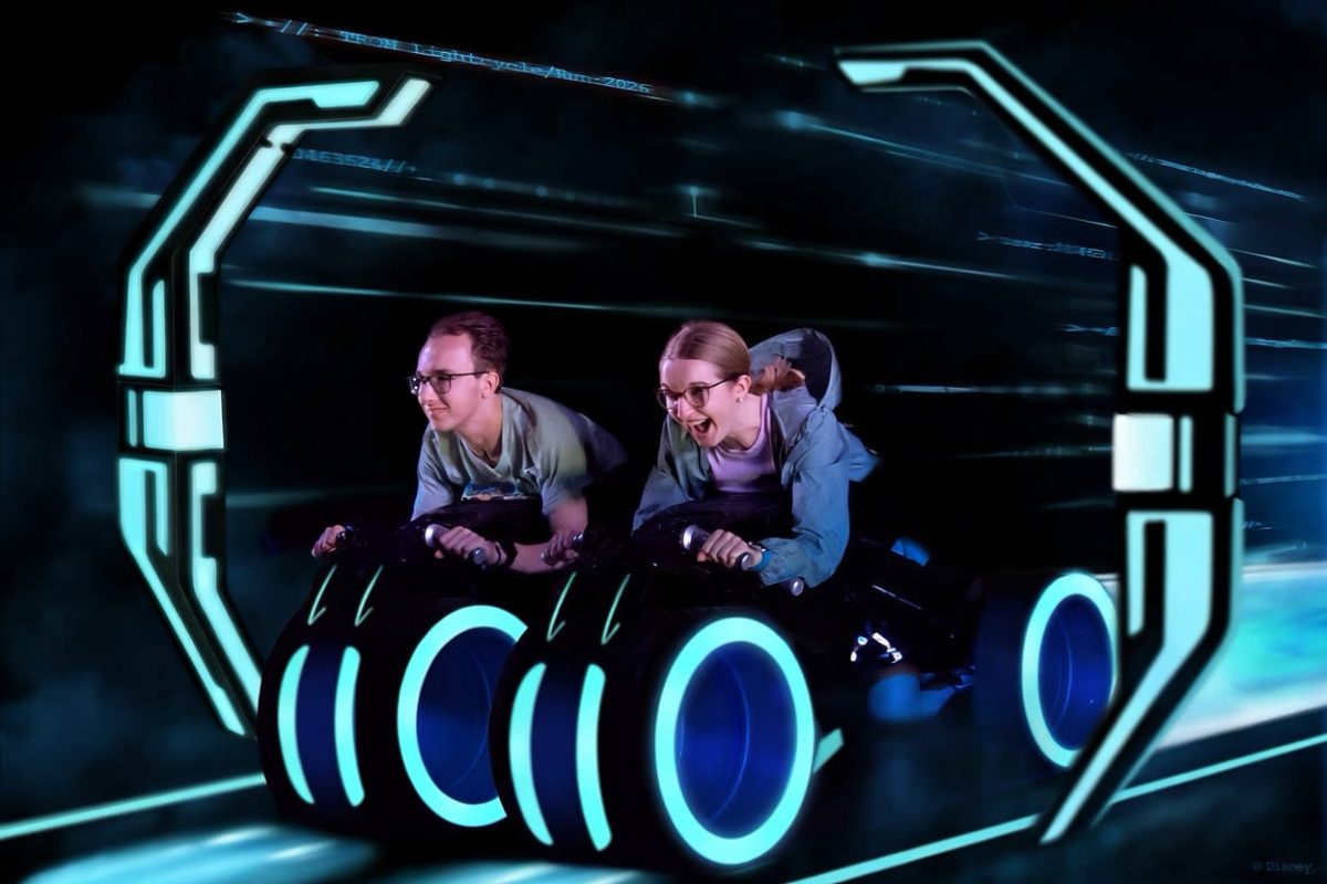 Senior Matthew Liepert and junior Rylee Shepard riding Tron, a motorcycle ride in Tomorrowland