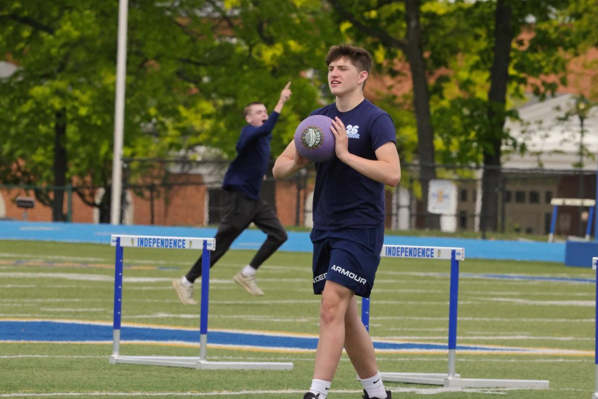 Senior Ryan Mack on the field at the kickball game on seniors' last day of classes. 