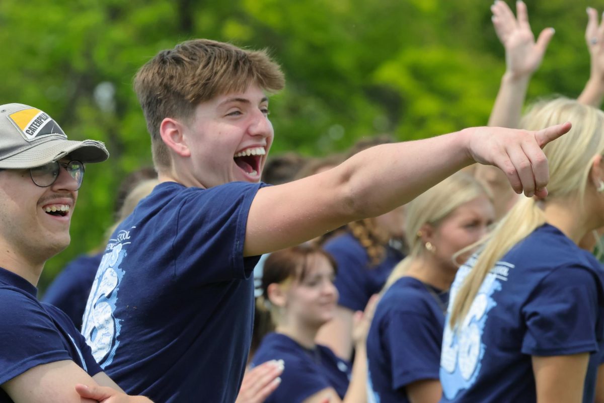 Senior Ryan Mack reacts to a play on the field during the kickball game on seniors' last day of school.