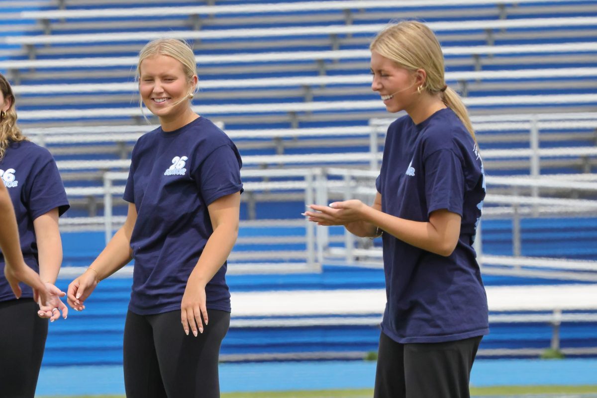 Seniors Maddie Mudra and Sofia Pichert at the kickball game on seniors' last day.