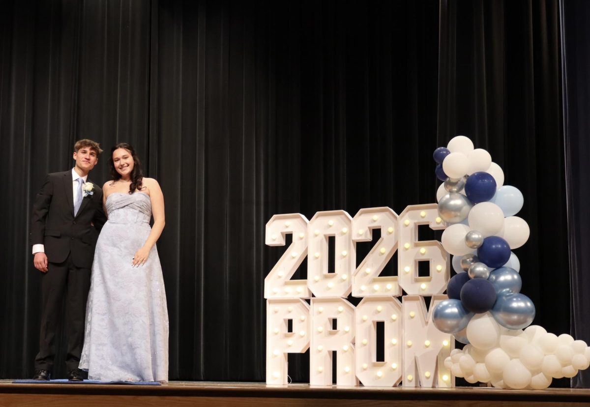 Gianna Londrico '26 escorted by Alex Jaworske '29 down the Blue Carpet 