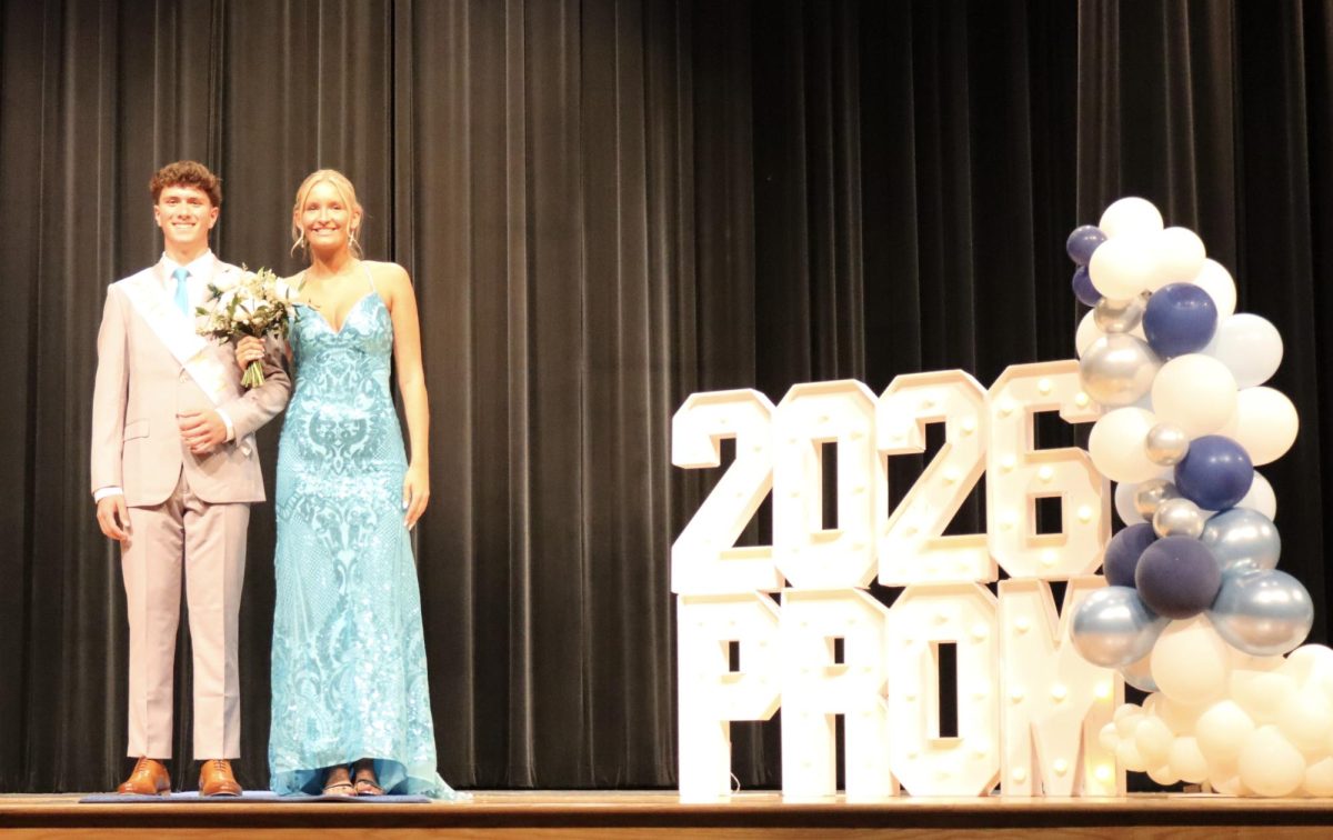 Haley Wilson '26 escorted by Liam Reinerth '26 down the Blue Carpet 