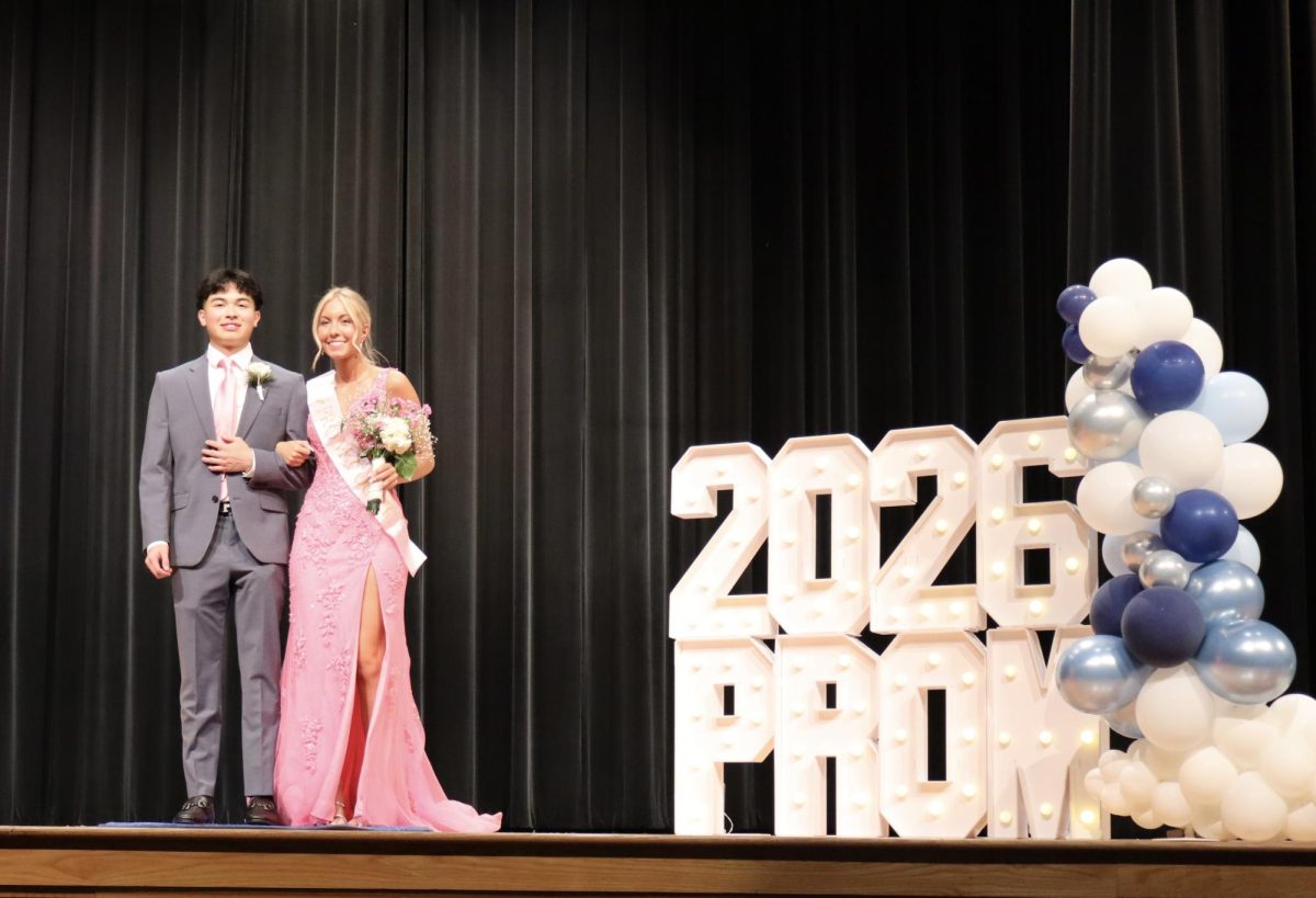 Sophia Pichert '26 escorted by Austin Si '25 down the Blue Carpet 