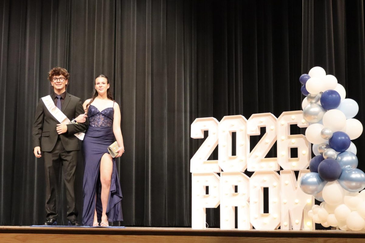 Armando Romano '27 escorting date down the Blue Carpet 