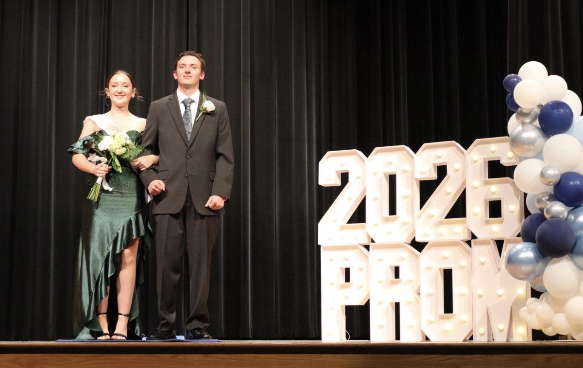 Samantha Haller '26 escorted by Joseph Fricano '26 down the Blue Carpet 