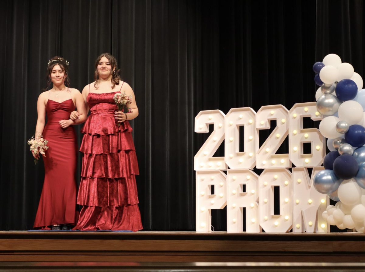 Alexandra Polcar '27 and Sarah Messina-Dysert '27 walking down the Blue Carpet 