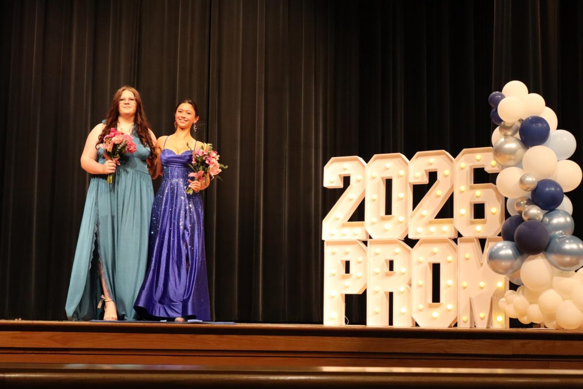 Kayla Newcomer '26 and Keira Pinion '29 walking the Blue Carpet